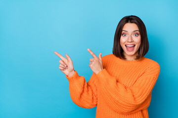 Portrait of attractive amazed cheerful girl demonstrating copy space ad new novelty isolated over...