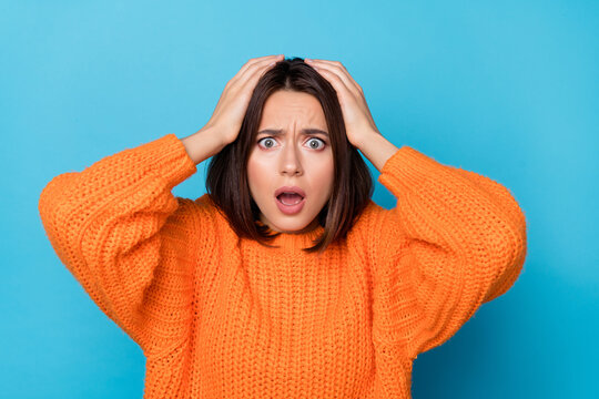 Portrait of attractive overwhelmed desperate girl bad news reaction fail isolated over bright blue color background
