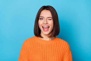 Portrait of attractive flirty cheerful girl winking good mood isolated over vibrant blue color background - obrazy, fototapety, plakaty