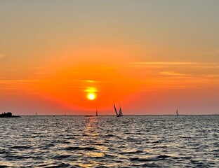 yachts in the sea at sunset