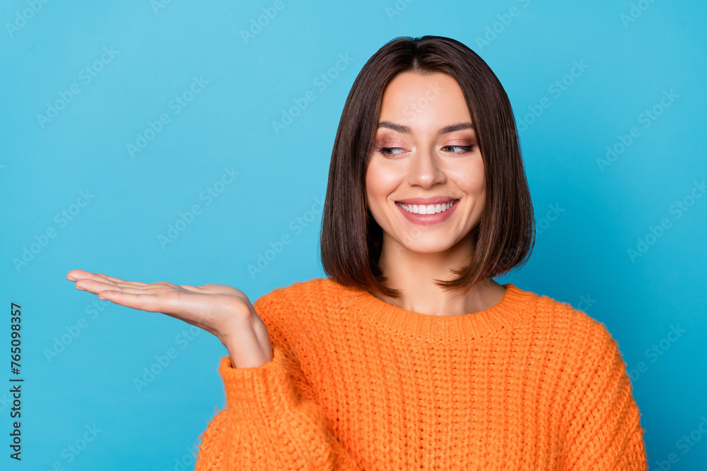 Canvas Prints Portrait of attractive cheerful girl holding on palm copy space ad new solution isolated over bright blue color background