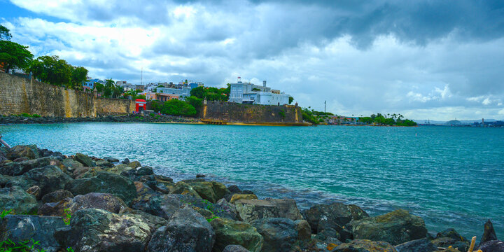 Old San Juan, or Viejo San Juan, at  Puerta de San Juan Gate Harbor built in 1635 in Bajo Tablazo Sandbank, a view from the Garita del paseo del morro under Castillo San Felipe del Morro Fort