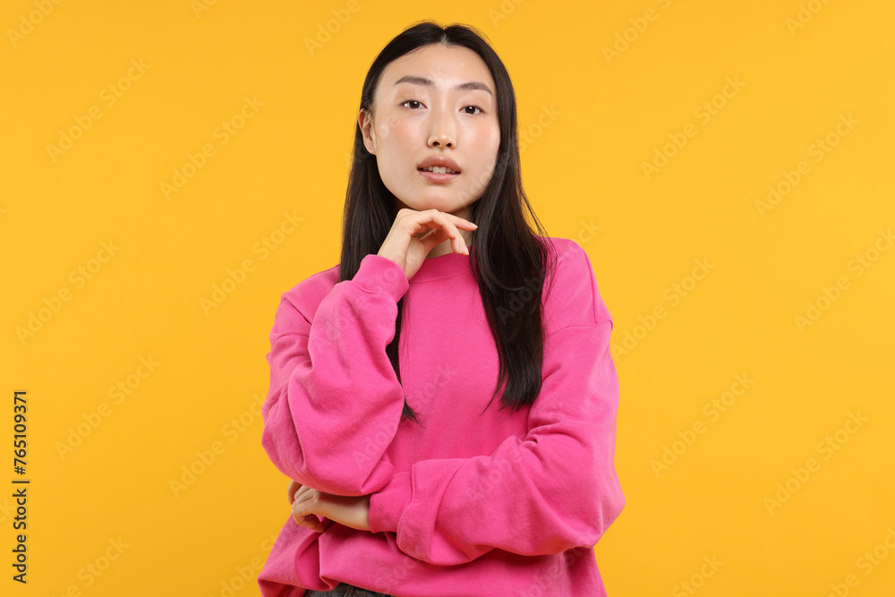 Sticker Portrait of beautiful woman on orange background