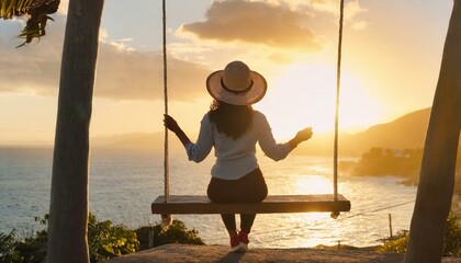 A woman sitting on a swing in front of the ocean and admiring the sunset , summer vibes 