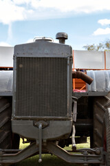 A tractor with grill upfront. 