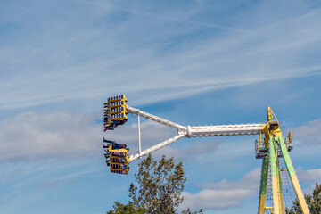 Amusement Park rides in the summertime, at the fair.