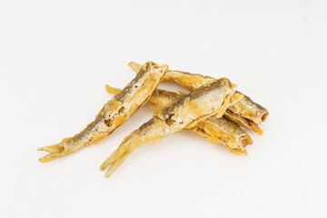 Fried small river fish on white background