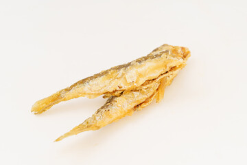 Fried small river fish on white background