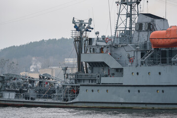Fototapeta premium WARSHIP - A navy fuel tanker maneuvers in a seaport