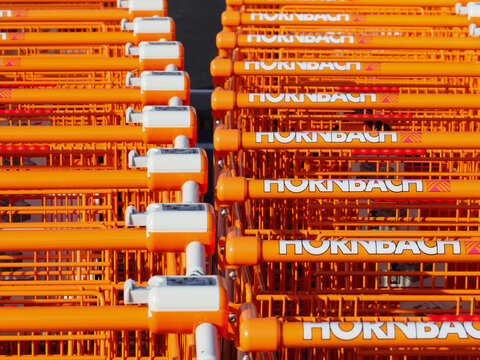 Orange white shopping cart from Hornbach Baumarkt AG, an operator of DIY stores and garden centers in Europe,  Germany, Paderborn, 16. October 2022