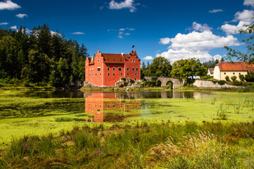 The Cervena (Red) Lhota Chateau is a beautiful and unique example of Renaissance architecture. It is located in the South Bohemian Region of the Czech Republic, surrounded by a picturesque lake. - 765145938