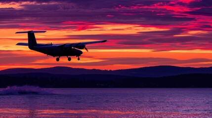 a plane flying over a body of water with a sunset in the background and a person on the other side of the water.