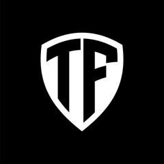 TF monogram logo with bold letters shield shape with black and white color design