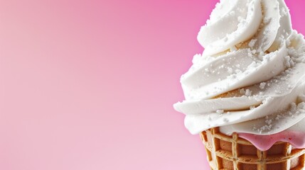 an ice cream cone with white icing and sprinkles on top of it on a pink background.