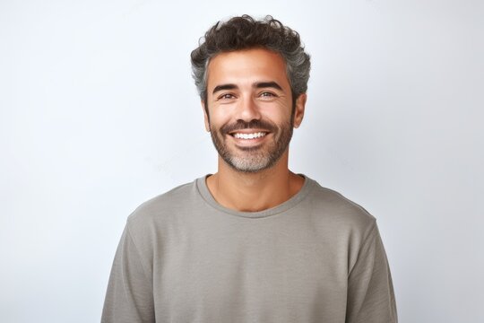 Portrait of a man with a beard smiling at the camera