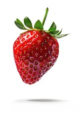 A strawberry in mid-air, perfect for food and fruit concepts