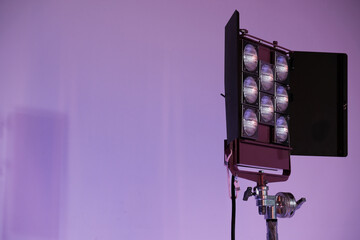 light beam in a video production studio, spotlight, stage shows, purple background