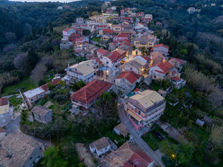 Aerial drone view of Antiperni village in north corfu, Greece by night