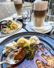 Coffee with ice cream and whipped cream on the table in Paris, France. 