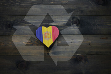 wooden heart with national flag of andorra near reduce, reuse and recycle sing on the wooden background. concept - obrazy, fototapety, plakaty