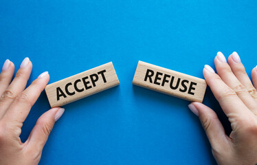 Accept or Reject symbol. Concept word Accept or Reject on wooden blocks. Businessman hand. Beautiful blue background. Business and Accept or Reject concept. Copy space