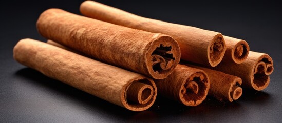A bunch of cinnamon sticks close-up on a table