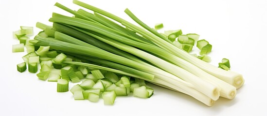 A bunch of fresh green onions on a white surface
