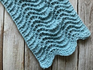 Knitted wool texture - old shale lace pattern also called feather and fan