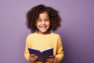 Photo of optimistic happy little girl hold read book study wear pullover isolated on violet color background - generative ai - obrazy, fototapety, plakaty