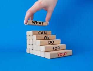 What can We do for you symbol. Wooden blocks with words What can We do for you. Beautiful blue...
