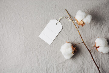 Cotton sprig on natural cotton fabric.