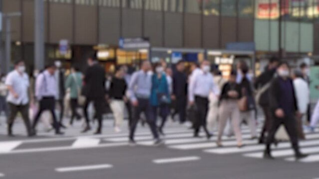 Anonymous Japanese Business people and Salary Men Crossing Street in Tokyo Financial District