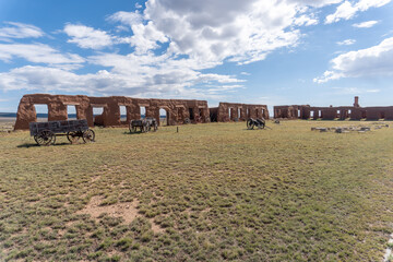 Fort Union National Monument in New Mexico. Preserves fort's adobe ruins along Santa Fe Trail. Remnants of Fort Union Depot Mechanic's Corral with wagons and wagon wheels. 