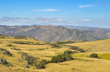 Naklejka premium Sunlight at dusk in the mountains of the Serra do Cipó region in Minas Gerais, Brazil