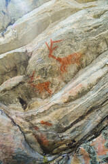 Cave paintings over five thousand years old painted on rocks in the Serra do Cipó region, Brazil