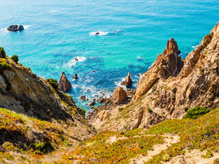 Impressive steep cliffs and emerald sea in Ursa beach (praia da ursa), Cabo da Roca cape, Portugal  - 765214745