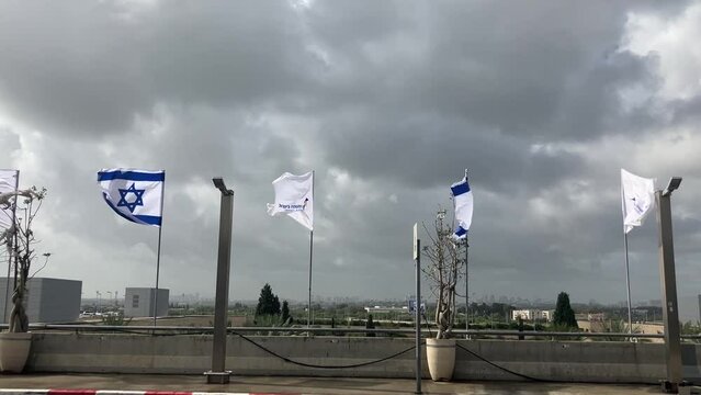 Ben Gurion Airport, Israel's air gateway. Flags in the wind, Israel flag and flag with international airport logo