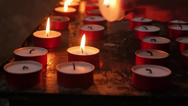 Caucasian Child Girl Lighting Up Wax Prayer Candle in Catholic Church
