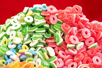 Colorful foam gummy sweets pile sold on market fair - 765234513