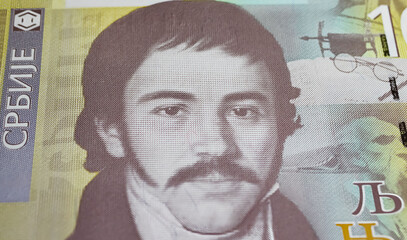 Portrait of Serbian philologist, anthropologist and linguist Vuk Karadzic  on 10 Dinar banknote (focus on center) - obrazy, fototapety, plakaty