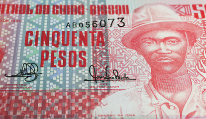 Closeup of Guinea-Bissau old Peso banknote currency (focus on center)