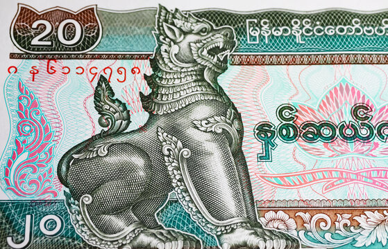 Chinthe lion burmese stylized symbol leograph  on Myanmar Kyat currency banknote from (focus on center)