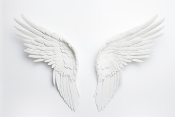 Ethereal white angel wings fully spread on a white background, invoking a sense of peace and purity. White Angel Wings Spread on White Background