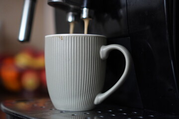 cup of coffee and maker