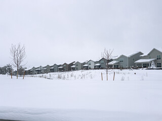Wintery Suburban Landscape Tranquil Under Snowfall