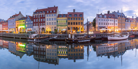 Panorama of Nyhavn with colorful facades of old houses and ships in Old Town of Copenhagen, Denmark. - 765247500