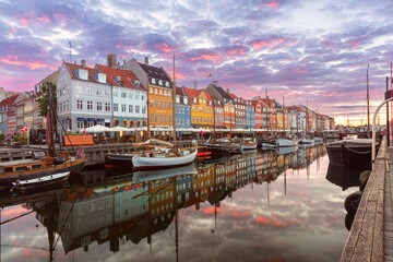 Nyhavn with colorful facades of old houses and ships in Old Town of Copenhagen, capital of Denmark. - 765251169