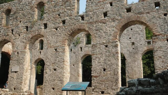 Ruins of Great Basilica in Butrint National Park, Buthrotum, Albania. Triconch Palace at Butrint Life and death of an ancient Roman house Historical medieval Venetian Tower surrounded. Butrint