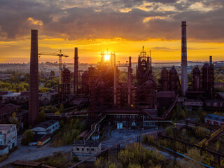 Blast furnace equipment of the metallurgical plant at the sunset, aerial view