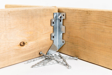 A galvanized steel rafter or joist hanger used in residential construction